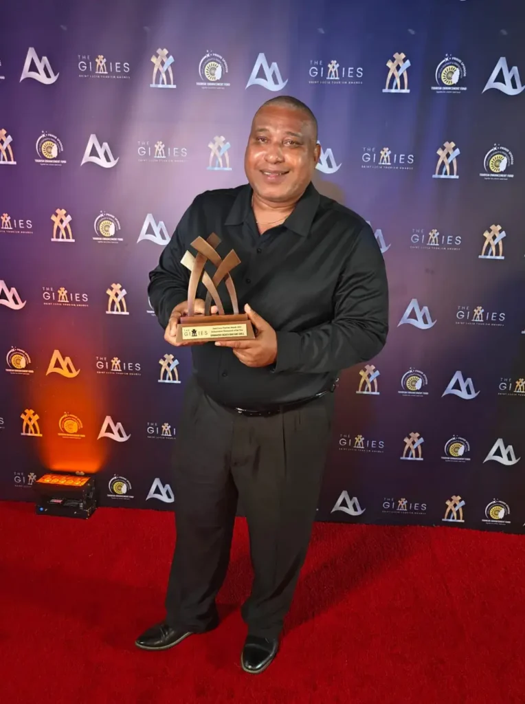 Spinnakers GM showing on the Gimmies Award on the red carpet.